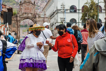 PERU - MAY 15, 2022: Peruvian people in traditional clothes in Cuzco.  Cusco, Peru, May 15, 2022