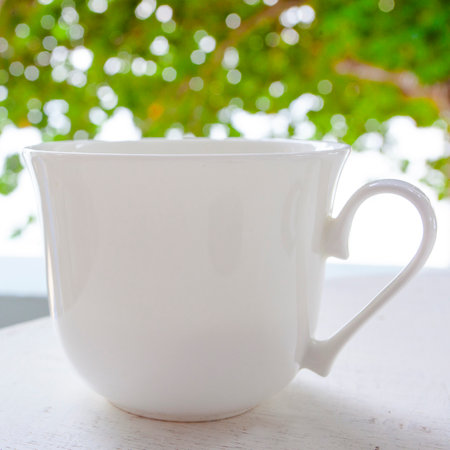 Large white cup of coffee on the fresh airの写真素材