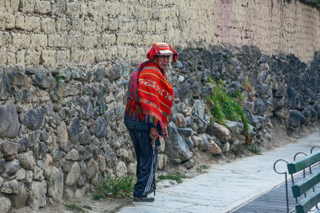 PERU - MAY 5, 2022: Peruvian man in traditional clothes on the street in Ollataytambo, Peru, May 5, 2022のeditorial素材