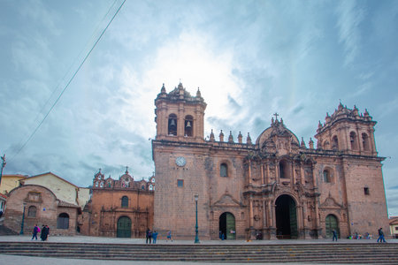 CUSCO, PERU - JAPRIL 30, 2022: Church of the Society of Jesus against sky at Plaza de Armas Square,...