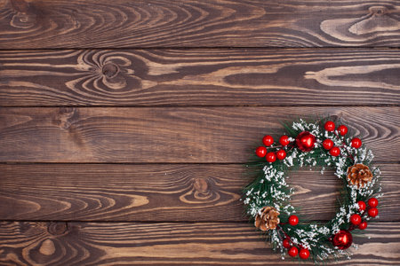 Christmas decorative wreath on wooden backgroundの写真素材