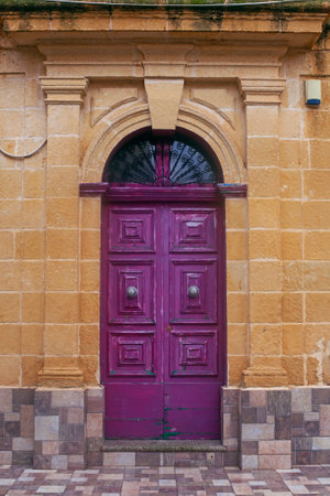 Narrow street of ancient city Rabat with traditional maltese houses built of limestone, Victoria, Maltaの写真素材