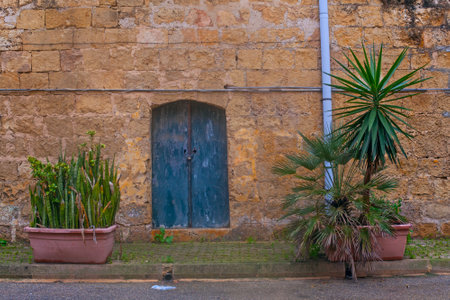 Narrow street of ancient city Rabat with traditional maltese houses built of limestone, Victoria, Maltaの写真素材