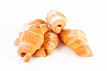 fresh croissant isolated over white backgroundの写真素材