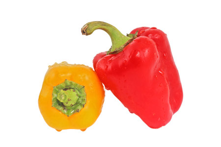 Red and yellow paprika pepper isolated on a white backgroundの写真素材