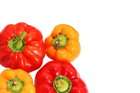 Red and yellow paprika pepper isolated on a white backgroundの写真素材
