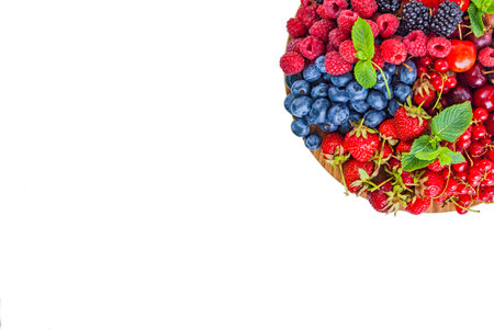 Fresh summer berries assortment on the round plateの写真素材
