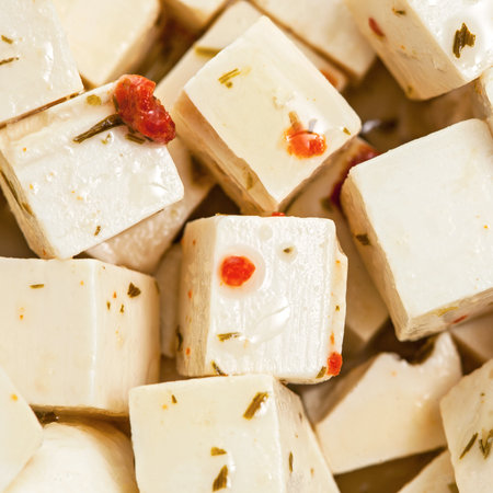 Feta cheese in oil with spicesの写真素材