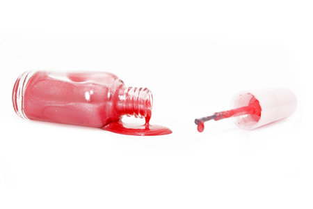 Pink nail polish and brush on white backgroundの写真素材