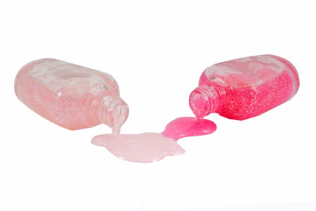 Bottle of pink nail polish and drop samples, isolated on whiteの写真素材
