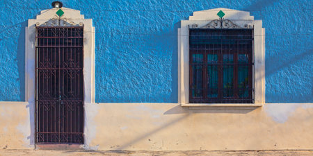 Bright blue houses of the downtown of Merida city in Mexicoの写真素材