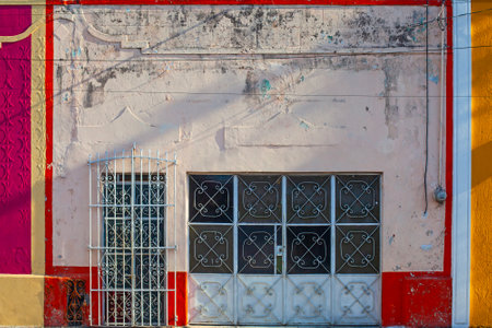 Small colonial style  colordul buildings at street of Merida city old town, Mexicoの写真素材