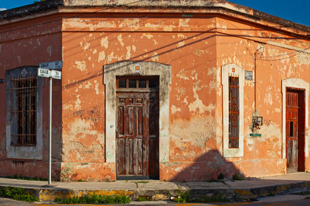 Merida, Yucatan , Mexico - 4 April , 2022: Small colonial style buildings at street of Merida city old town, Mexicoの写真素材