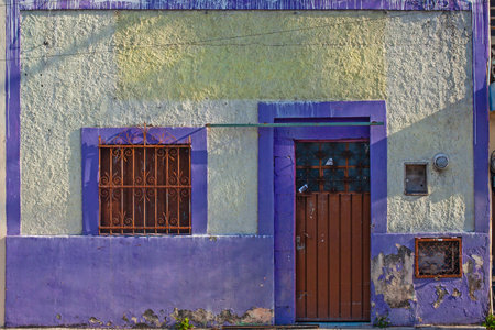 Small colonial style colorful buildings at street of Merida city old town, Mexicoの写真素材