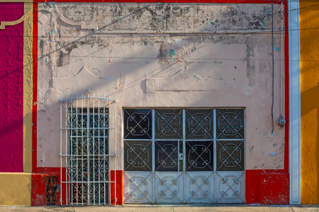 Small colonial style  colordul buildings at street of Merida city old town, Mexicoの写真素材