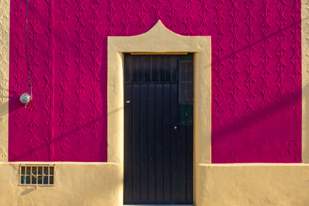 Colorful pink houses on the streets in downtown Merida, Mexicoの写真素材