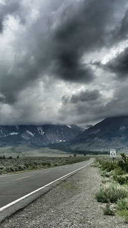 A road leads into stormy eastern Sierra Nevada Mountains.の写真素材