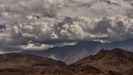 Storm clouds gather over eastern Sierra Nevada mountains in California.の写真素材
