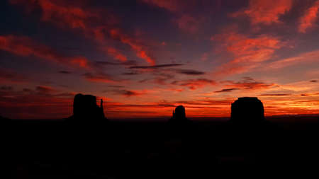 A fiery sunset over classic Monument Valley.の写真素材