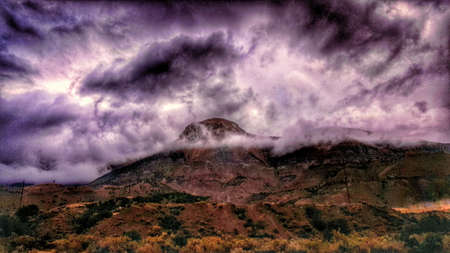 Beautiful storm clouds surround a Colorado peak.