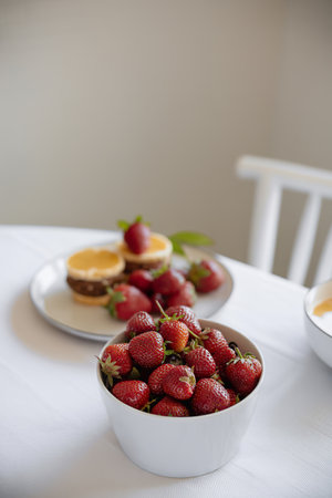 Fresh strawberries with healthy brunch on a dining tableの写真素材