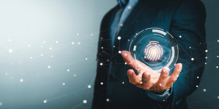 Businessman hand using fingerprint indentification to access personal financial dataの写真素材
