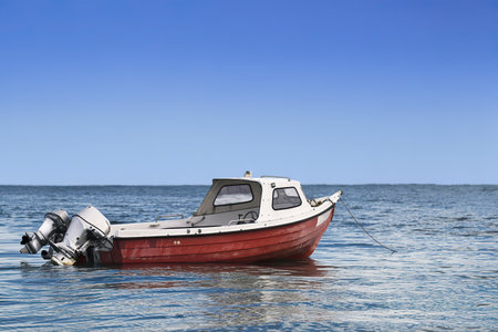 Small fishing boat in the seaの写真素材