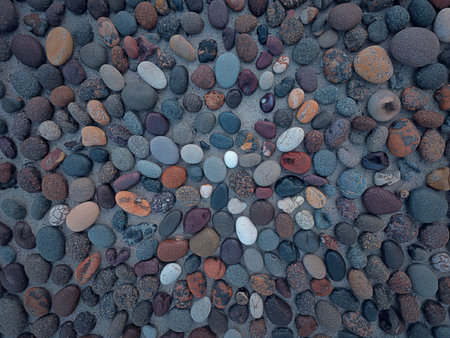 A top view of a pile of small pebbles arranged in an abstract patternの写真素材