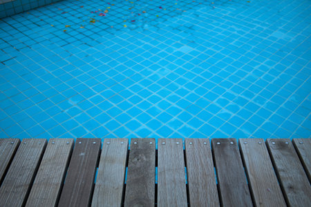 wooden top with swimming pool background