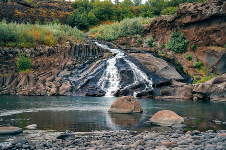 Hraunfossar is unique water falls in Iceland water flows under lava stones