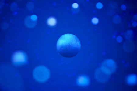 A solitary, textured blue sphere floats in the center, surrounded by a softly blurred background of...