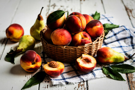 side view of peaches in basket with pears on wooden backgroundの写真素材