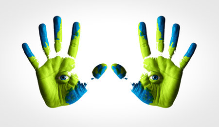 Two colorful handprints, painted with green and blue, are displayed against a white background, mirroring each other.の写真素材