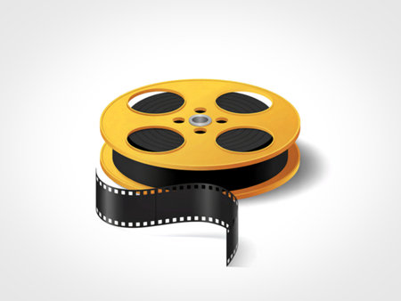 A classic yellow film reel sits on a white background with a black film strip partially unspooled and draped over the front.の写真素材