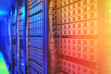 An image of a data center featuring rows of server racks illuminated by colorful lights,...