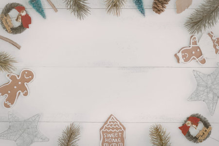 christmas decorations including gingerbread man, gingerbread house, pine branches, pine cones,...