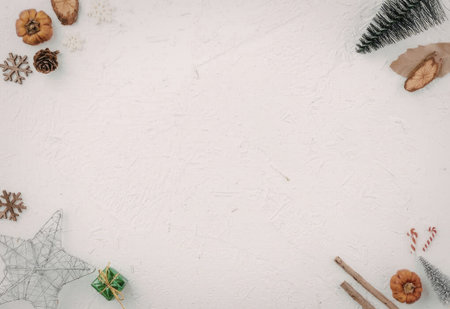 A white background with various holiday decorations such as pinecones, pumpkins, and a spider web.