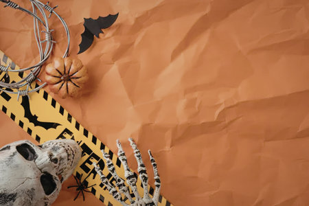 An orange background with Halloween decorations including a skeleton, bat, and pumpkin.