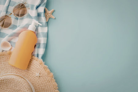 A collection of summer beach essentials including a straw hat, sunglasses, sunscreen, seashell,...