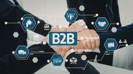 Professionals making a handshake surrounded by digital icons symbolizing business to business...