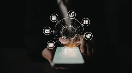 Businessman holds a tablet with glowing digital icons and graphics symbolizing connection, data, and...