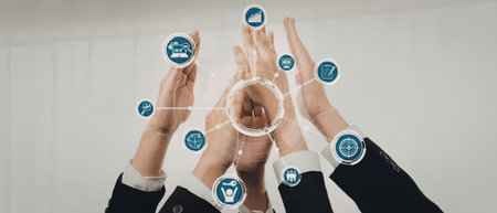 Business professionals in formal attire collaborate and celebrate success with digital technology...