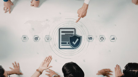 Group of people gather around a table discussing cybersecurity and data protection measures...