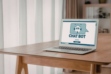Modern laptop on wooden desk displays chatbot interface for customer service featuring cartoon robot...