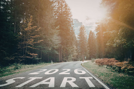 Serene forest road with 2026 start message painted on it symbolizing new beginnings and a hopeful...
