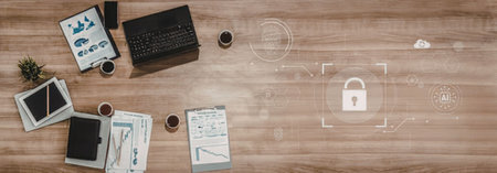 Office workspace with laptop and documents on wooden desk highlighting data security and protection...