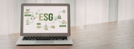 Laptop screen displays esg concept with various green icons symbolizing environmental social...