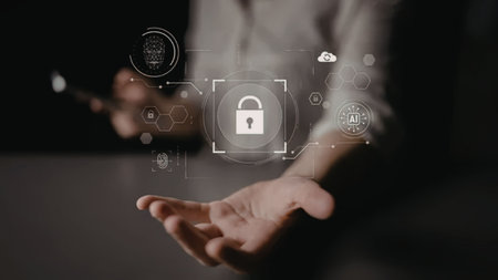 Person holds out their hand displaying digital icons representing cybersecurity and data protection...