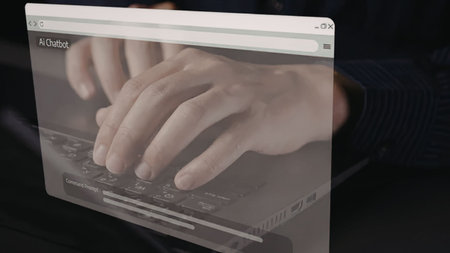 Person is typing on a laptop with an Ai Chatbot interface displayed on the screen, showcasing modern...