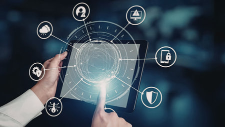 Person uses tablet with glowing cybersecurity interface and various icons connected by lines...